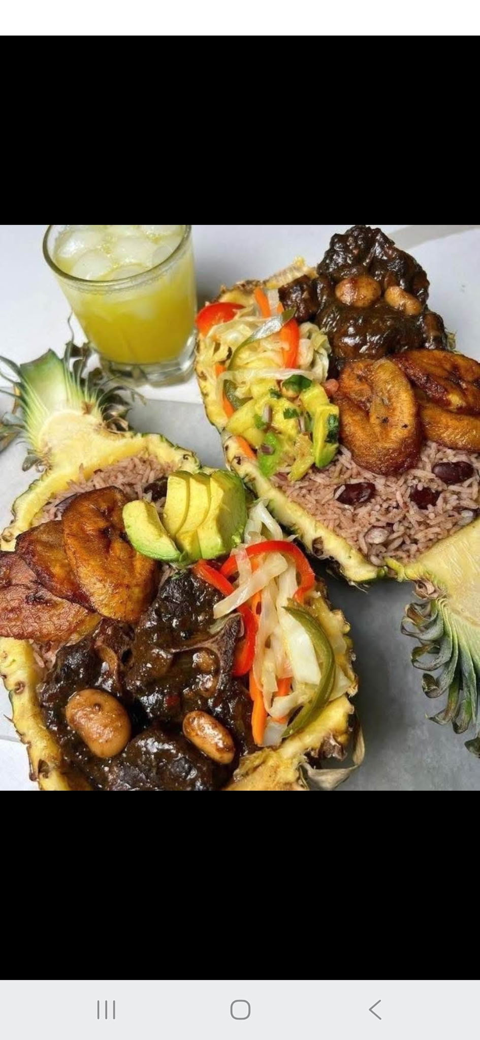 Pineapple bowls with rice, meat, plantain and avocado