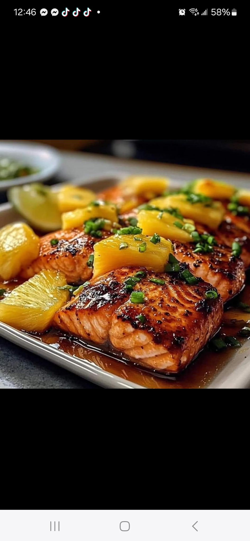 Glazed salmon topped with pineapple