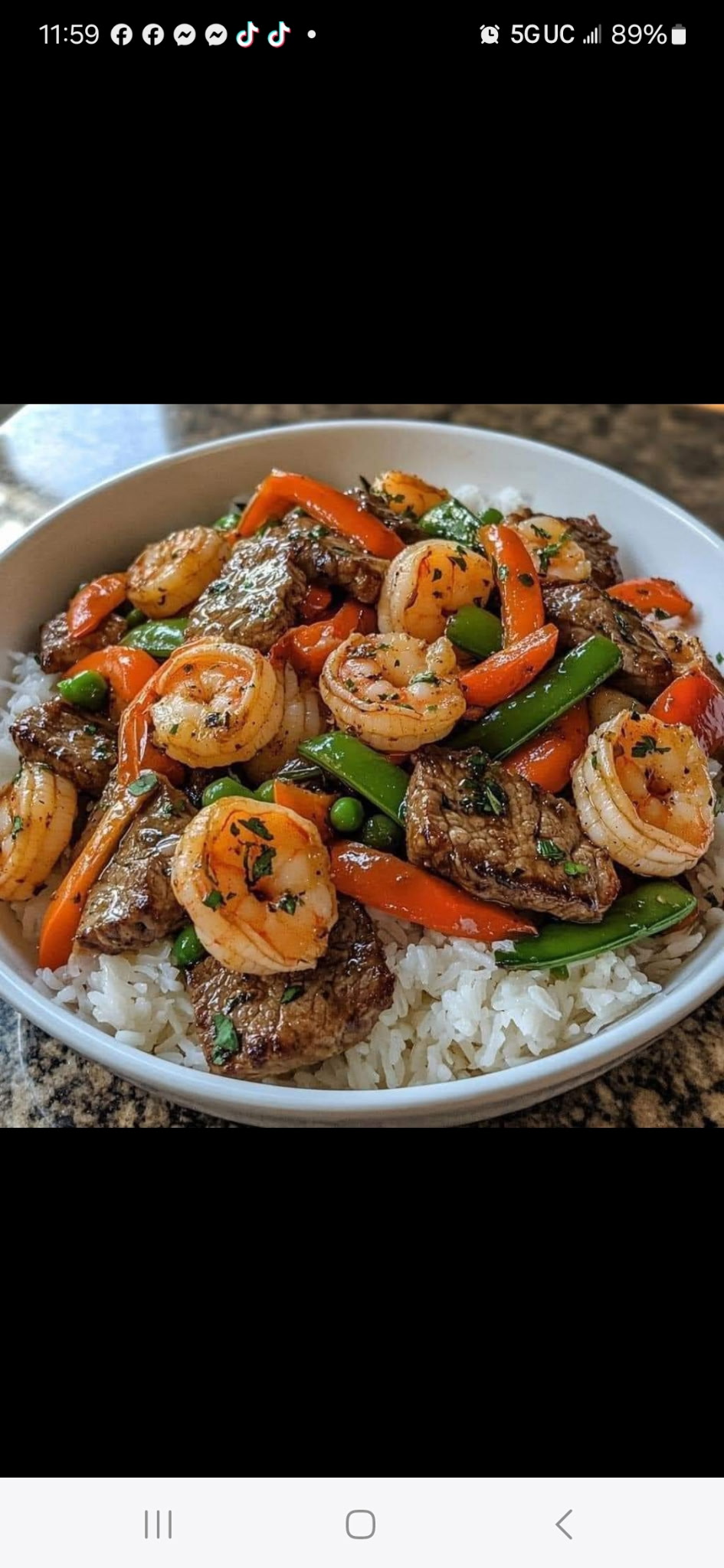 Shrimp and beef with vegetables over rice